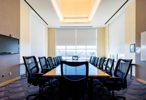 Table, chairs and TV in L200 conference room