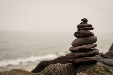 stacked rocks next to beach