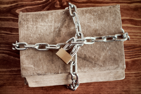 Book chained with a padlock.