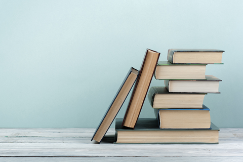 Stack of books on a table.