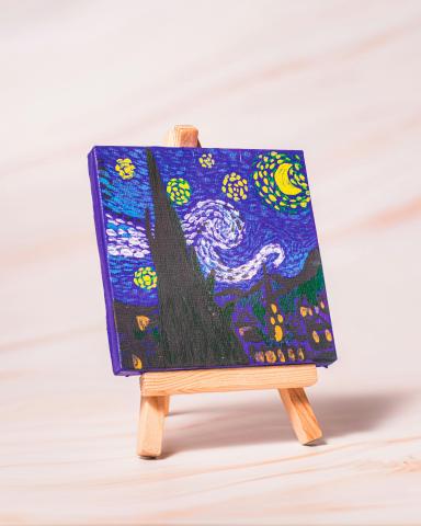 Mini canvas with Monet 'Starry Night' recreation sitting on easel.