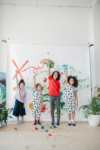 group of children celebrating artwork