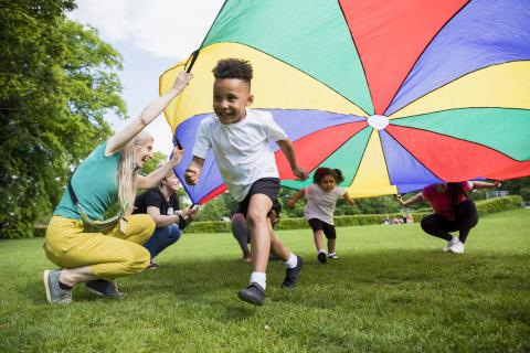 Children playing with a parachute