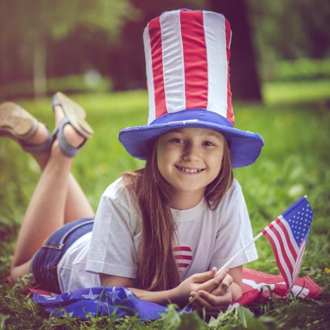 child celebrating Independence Day