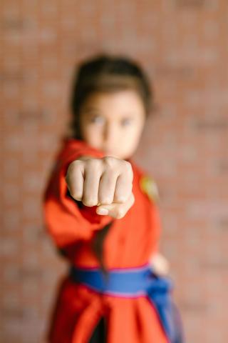 Small girl in martial arts attire