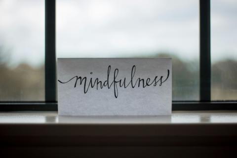 Paper with Mindfulness written on it sitting in window