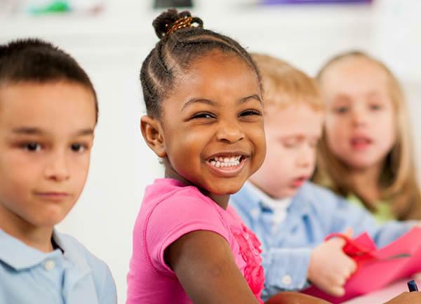 Four preschoolers at a table