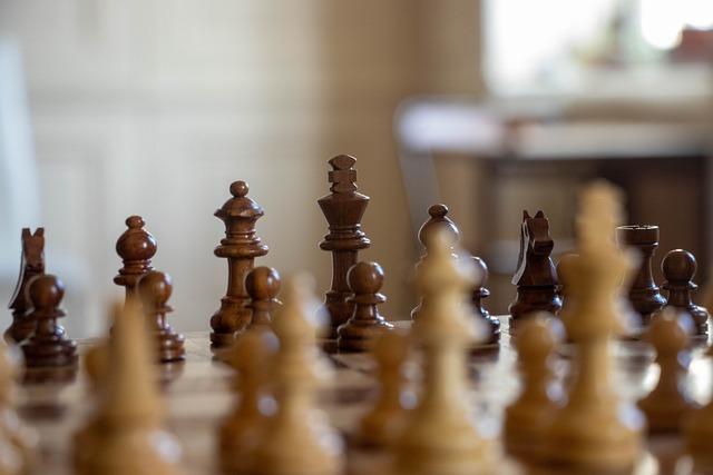 Chess pieces pictured from level of chessboard.