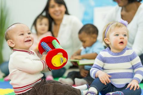 Babies playing and listening