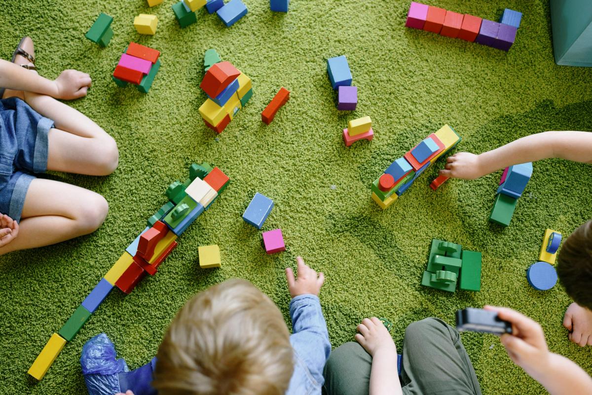 children playing with colorful blocks