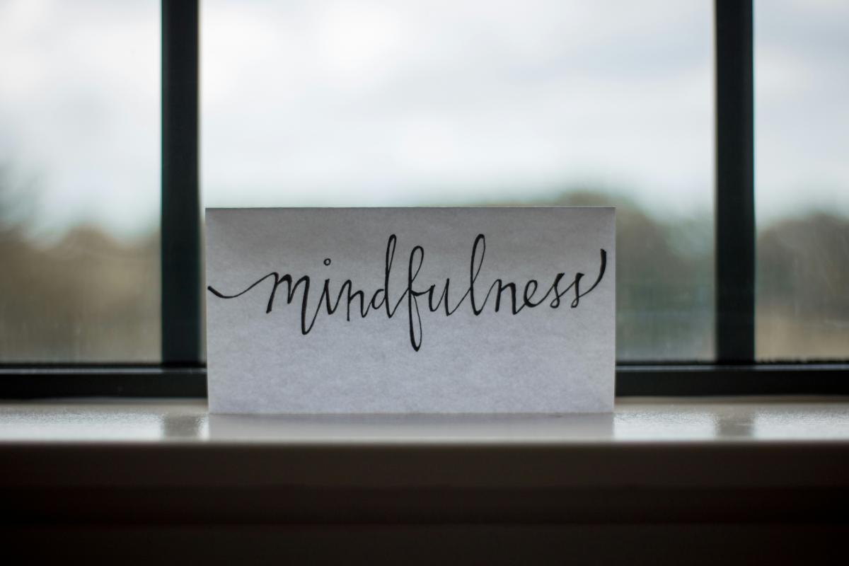Paper with Mindfulness written on it sitting in window