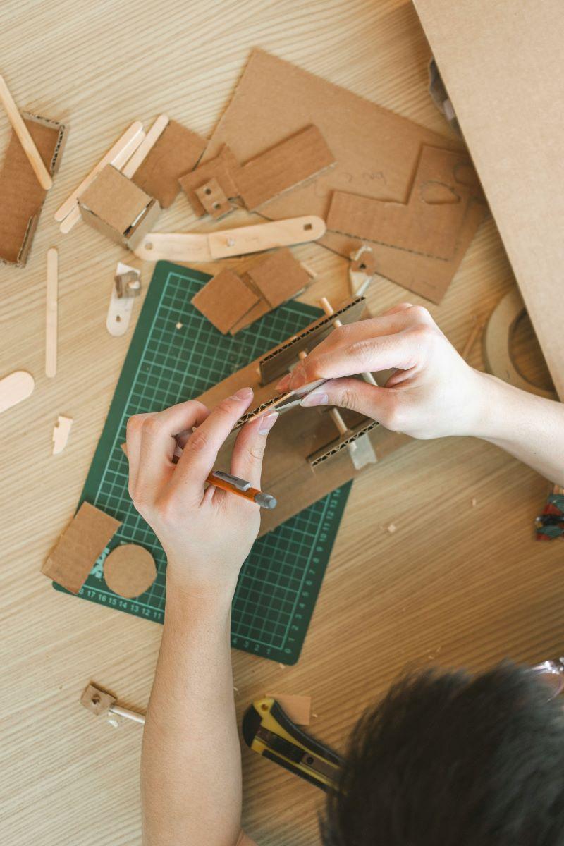 Person building with cardboard